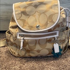 NWOT COACH Poppy backpack - tan w/ purp. interior